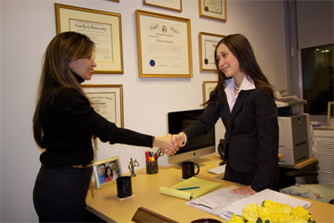 myriam shaking hands with a client